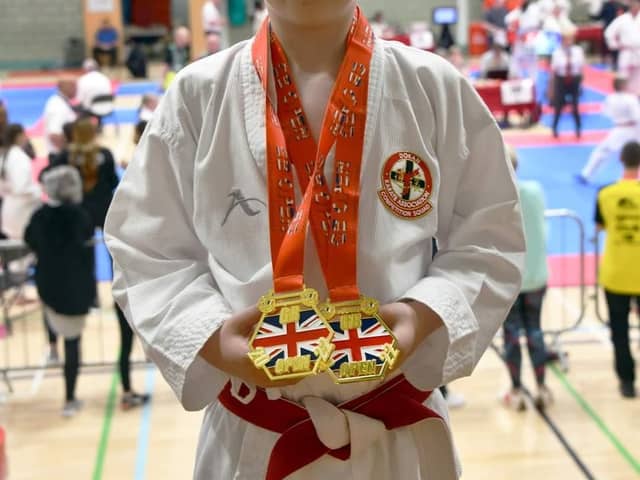 Ewan Baxter with his two golds.
