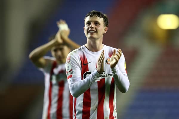 WIGAN, ENGLAND - SEPTEMBER 21: Nathan Broadhead of Sunderland interacts with the crowd following the Carabao Cup Third Round match between Wigan Athletic and Sunderland at DW Stadium on September 21, 2021 in Wigan, England. (Photo by Jan Kruger/Getty Images)