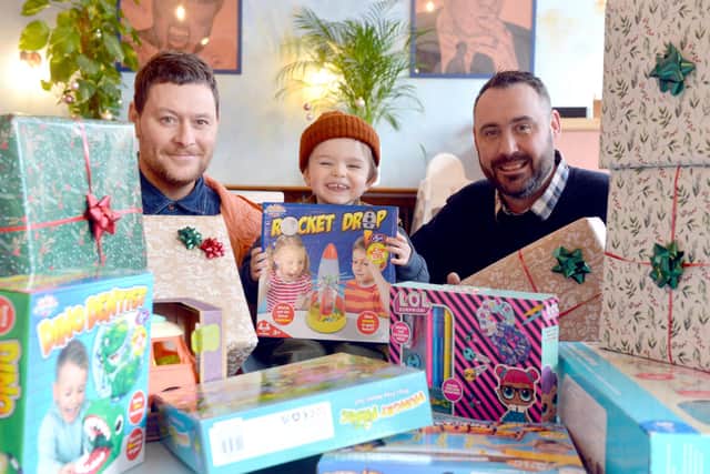Proven People part owner Lee Forster with his son Reggie Robinson Forster, two and chef Leon Dodd (right) are running a Christmas toy appeal.