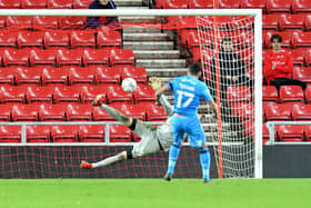 Gareth Evans scores the winning penalty for Bradford City