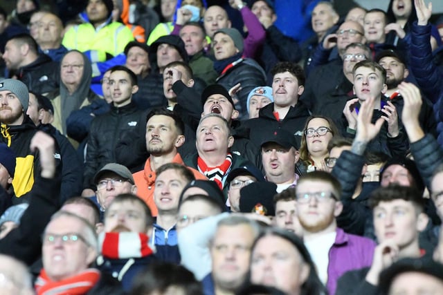 Sunderland fans in action away to Huddersfield Town at the John Smith's Stadium where goals from former Terrier Alex Pritchard and Manchester loanee Amad Diallo handed the Black Cats the win in the Championship.