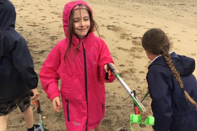 Year 2 pupils carrying out their beach clean.