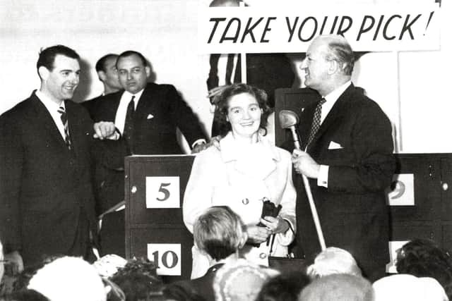 Television celebrity Michael Miles pictured with his Take Your Pick show which he brought to Joplings in 1963.
