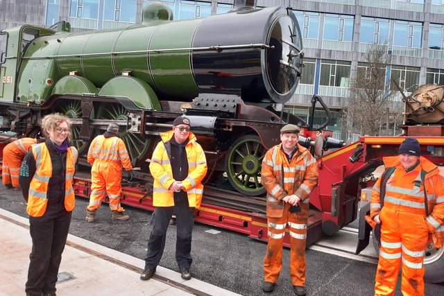 National Railway Museum staff next to engine number 251 asait rrives in Doncaster Museum  on the back of a lorry