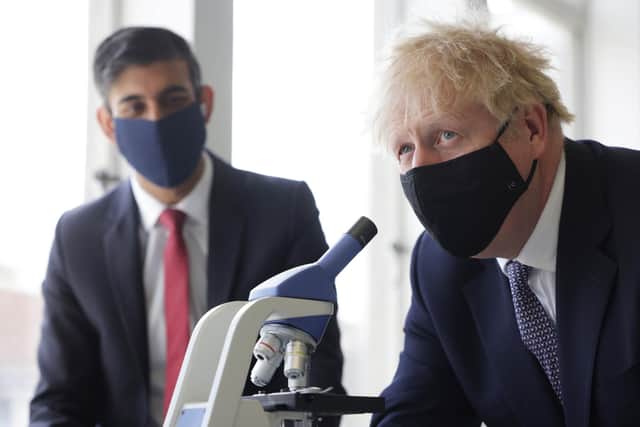 Prime Minister Boris Johnson (right) and Chancellor of the Exchequer Rishi Sunak are both able to avoid having to isolate despite being pinged, Downing Street has said. The pair pictured taking part in a science lesson in  April 2021.