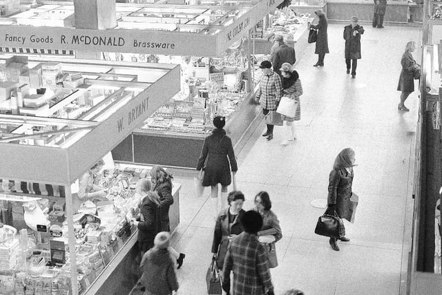Bagging a bargain at Jacky White's Market in 1973.