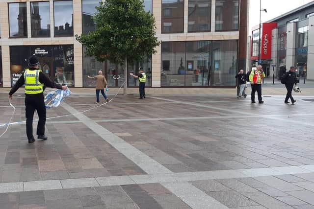 Police officers begin to lift a cordon in Sunderland city centre following earlier reports of a 'malicious communication'.