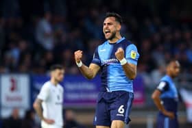 Wycombe defender Ryan Tafazolli celebrates after scoring against MK Dons. (Photo by Clive Rose/Getty Images)