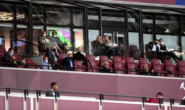 Mike Ashley watches from the front row of the directors' box.