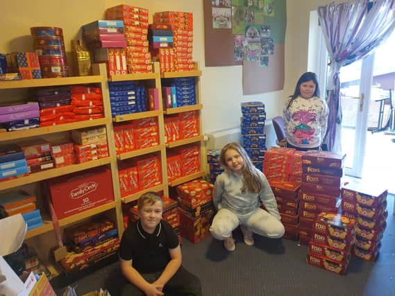 Members of The Little Onion Club with the biscuits they collected