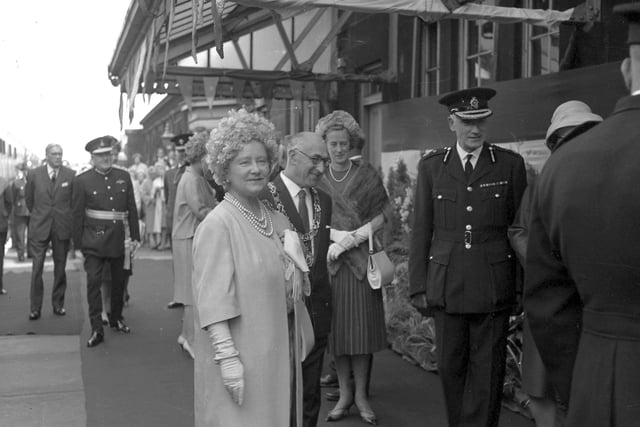 The Queen Mother arrives at Monkwearmouth Station, Sunderland, in June 1964. Her Majesty is pictured with Sunderland's Mayor (Ald R Wilkinson) and Chief Constable, Mr W Tait.
