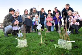 Nursery children, staff and parents from Hasting Hill Academy planting their saplings.