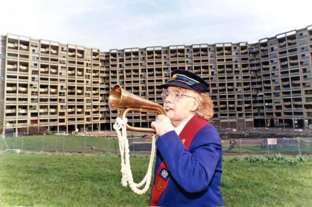 Resident Marion Day certainly wasn't sad to see the back of Kelvin Flats as she played the last post when they were demolished on March 10, 1995