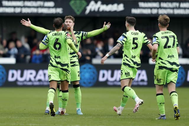 Forest Green Rovers' Connor Wickham celebrates with his team-mates after scoring their side's second goal of the game during the Emirates FA Cup first round match at the 1st Cloud Arena, South Shields. Picture date: Saturday November 5, 2022.