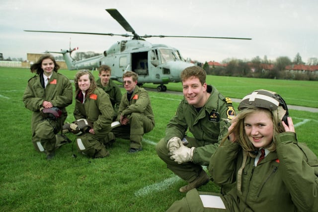 A career lesson from the Royal Navy at Southmoor School in 1993. Pictured front are Joanne Parkin, 14, with pilot Iain Banks; and Suzanne Fisher, 15, and Claire Wood, 14 with mechanics Ian Willey and Adrian Parsons.