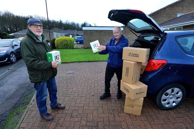Cllr Bernie Scaplethorn (right) gets a helping hand loading donated Christmas Hampers into his car by Brian Wilson from Feeding Families. Picture by Frank Reid