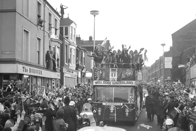 The open top bus in Vine Place. Fans even used the roof of shops and pubs to get a view.