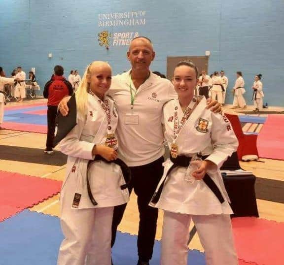 Dokan chief coach Kevan Mitchinson with medal winners Eleisha Mitchinson, left, and Elle Smith.