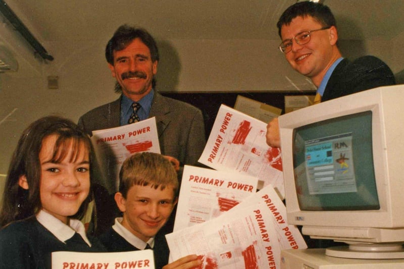 Dyke House school pupils Melissa Flush and David Fryer show head teacher Bill Jordan (left) and Les Rix from Comcast Teesside their editing skills after they produced Primary Power in July 1997. Remember this?