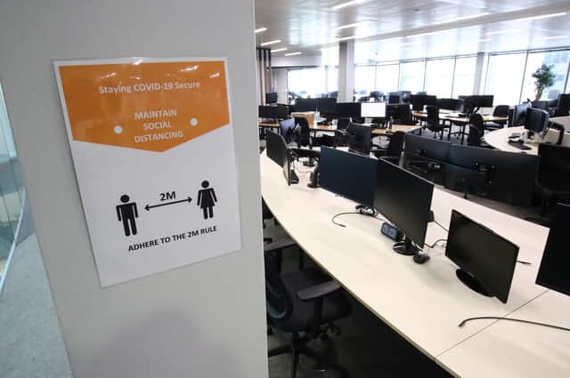 A poster specifying social distancing requirements in a Covid secure office workplace