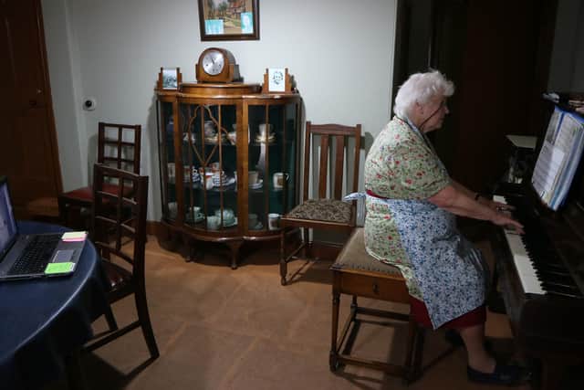 Ruth Young, 86, plays the piano and leads the singing at the sessions.