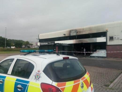 Northumbria Police outside the shop in the wake of the fire.
