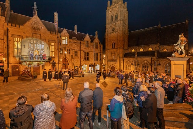 People gather in Durham City's Market Square to the pay their respects to the recently deceased Queen Elizabeth II.

Photograph: James Thompson & Edson Baptista