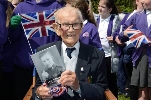 Len Gibson with a copy of his memoirs.