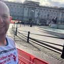 Chris in front of Buckingham Palace while taking part in the London Marathon.