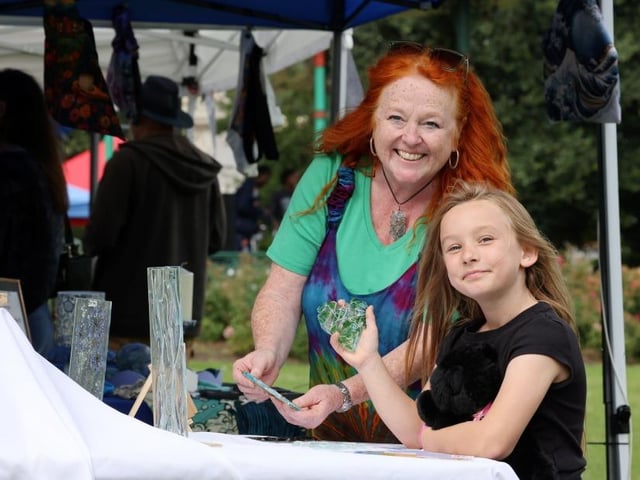 Food vendors, local traders and community organisations added to the festival atmosphere. Willow aged seven with Luc Glass store owner Nadine Lucas.