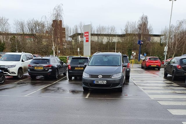 This car was pictured in the car park of TK Maxx, where it was not only blocking two spaces by parking across the white line, but was partially blocking a third space behind as well.