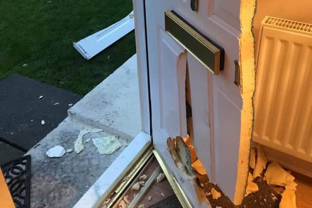 Door smashed in during a raid.