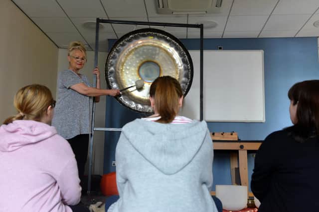 Carers experiencing a gong bath treatment.
