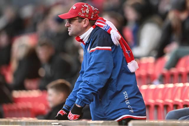 STOKE ON TRENT, ENGLAND - MARCH 05: A Stoke City fan looks dejected after the Sky Bet Championship match between Stoke City and Blackpool at Bet365 Stadium on March 05, 2022 in Stoke on Trent, England. (Photo by Nathan Stirk/Getty Images)