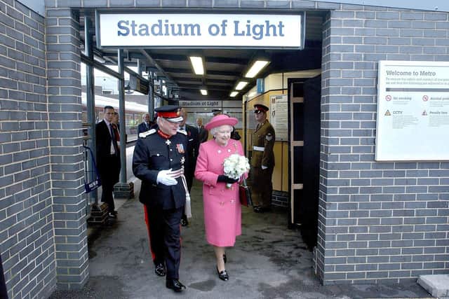 Her Majesty the Queen leaving the station with the flowers which were presented to her by Lois Chapman.
