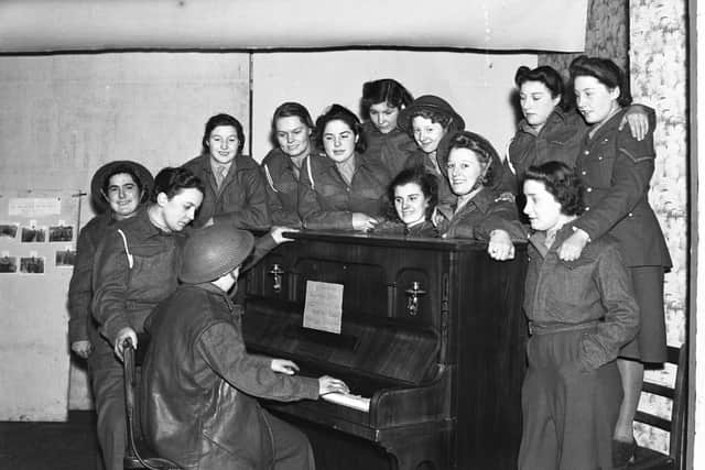 A seasonal singalong in an anti aircraft battery canteen on Wearside in 1941.