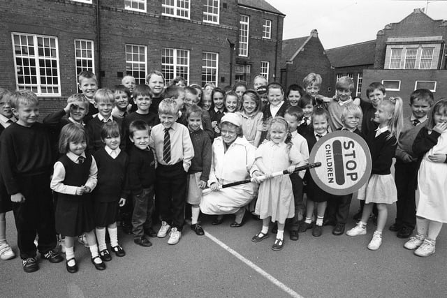 Sylvia Todner gets some help from her little friends on her last day as lollipop lady at Ryhope 31 years ago.