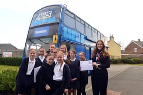 Hetton Lyons Primary School pupils with NHS Careers Programme Coordinator, Laura Watkins, outside the Melissa bus.