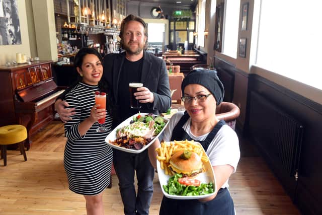 Food and drinks served at The Peacock. Managers from left Cindy Godoy, Barry Hyde and chef Milleide Godoy.