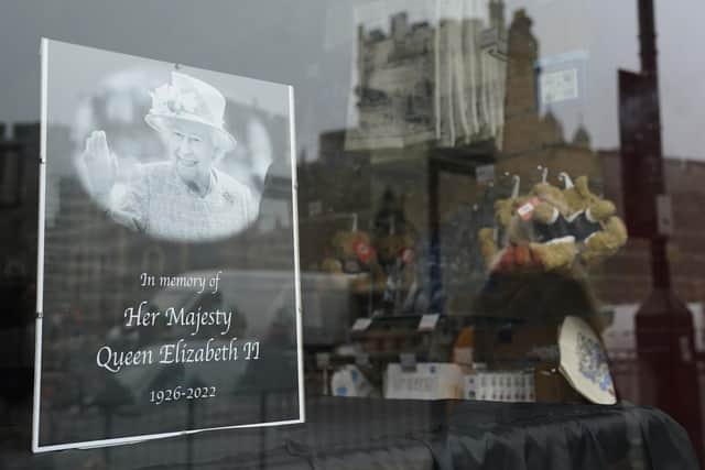 A photograph in memory of Queen Elizabeth II seen in the window of a shop in Windsor. Picture: Andrew Matthews/PA Wire