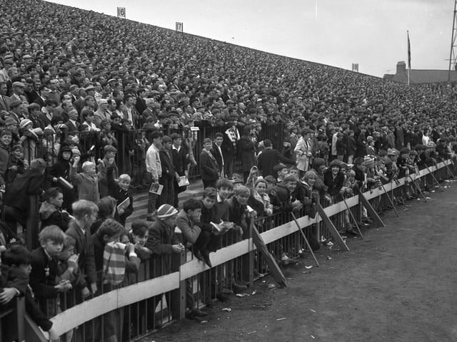 With the summer holidays comes the pre-season and then, of course, the season proper! Crowds pictured at Roker Park in August 1964.