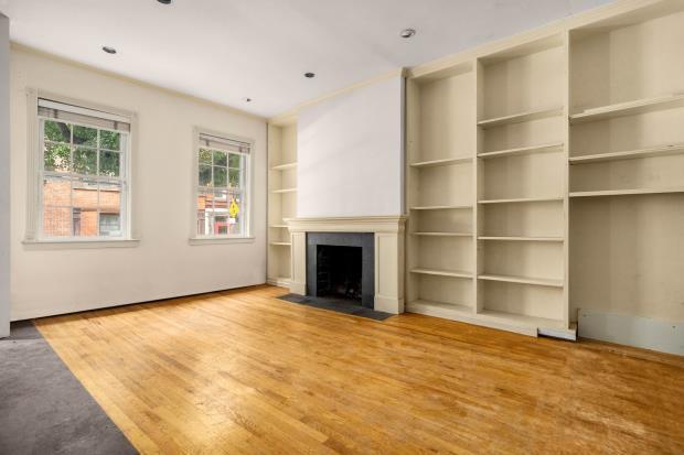 The entire property - the townhouse and carriage house - is on the market with Savills Global Residential for $5.5 million, about £3.96m.