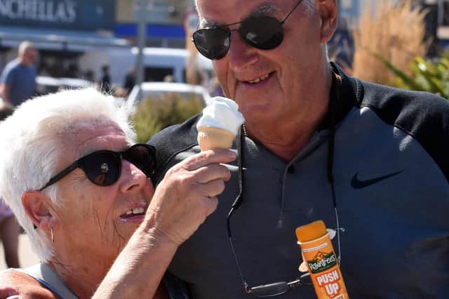 June Compton temps husband Jimmy with her ice cream