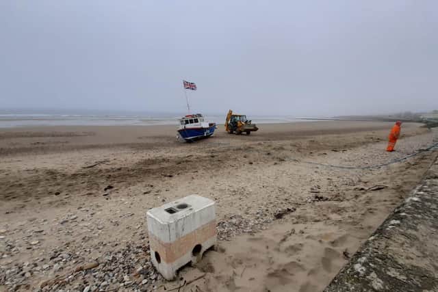 A concrete block was brought in to help in efforts to help Pelican refloat once the tide came in.