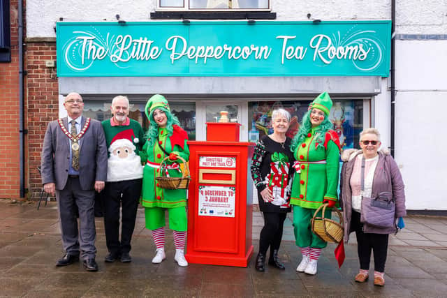 Christmas Elves outside The Little Peppercorn Tea Room and one of the Post Box Trail boxes in Hetton le Hole with Mayor Dave Geddis, Michael & Carol McGlinchey (Peppercorn) and Cllr Kathleen Pearson.
