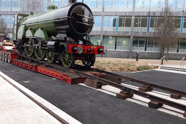 Temporary rails were put in place to allow engine number 251 to move slowly off the back of a lorry and into Doncaster's new museum. They can been seen in front of the loco