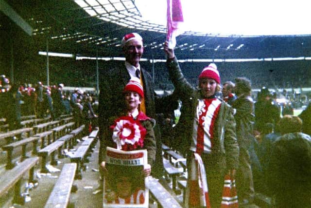 Michael with his dad and brother at Wembley.