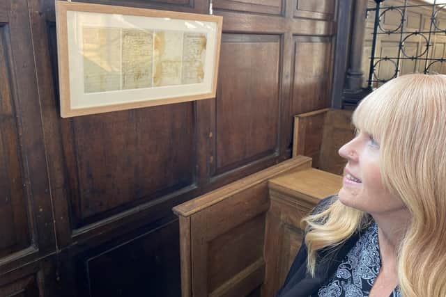 17Nineteen’s Centre Manager Tracey Mienie sat in William's seat, above which his 125 year old letter now hangs.