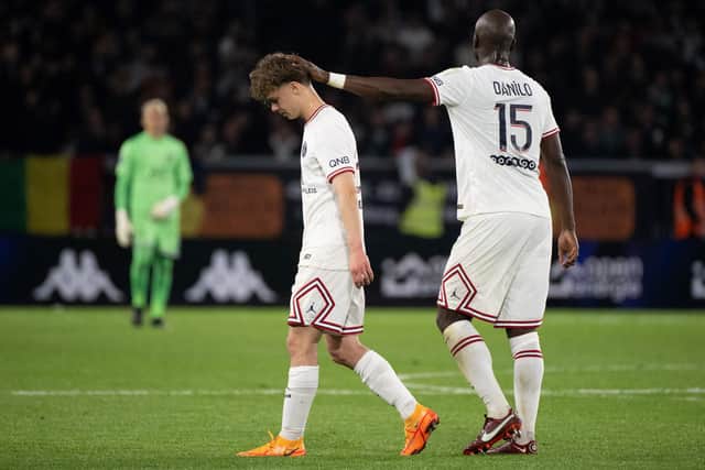 Paris Saint-Germain's French defender Edouard Michut (L) leaves the pitch after receiving a red card during the French L1 football match between Angers SCO and Paris Saint-Germain at the Raymond-Kopa Stadium in Angers, north-western France on April 20, 2022. (Photo by LOIC VENANCE / AFP) (Photo by LOIC VENANCE/AFP via Getty Images)