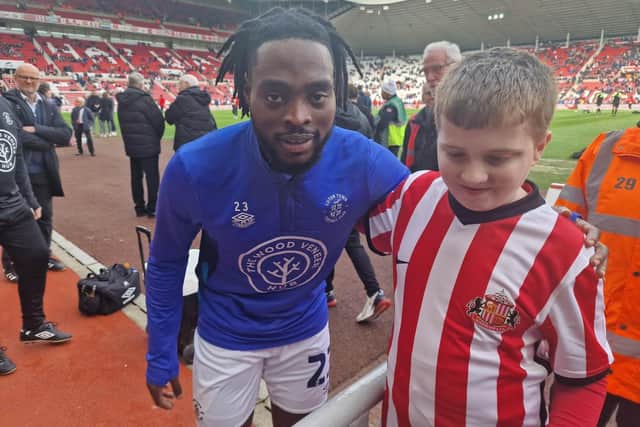 Jack with Luton Town FC player Fred Onyedinma.